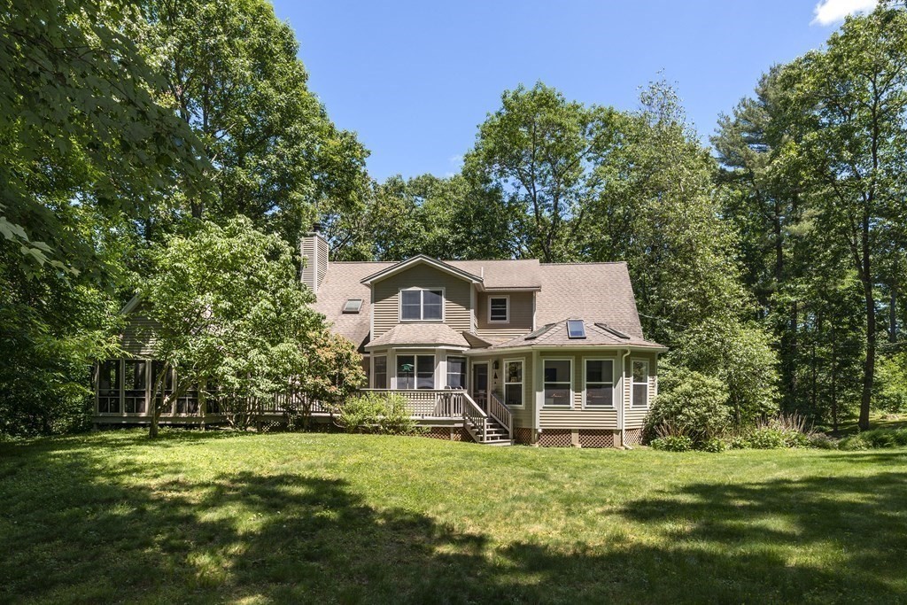 21 Mill Road Ipswich, MA 01938 - Photo 2 of 23 a front view of a house with a garden