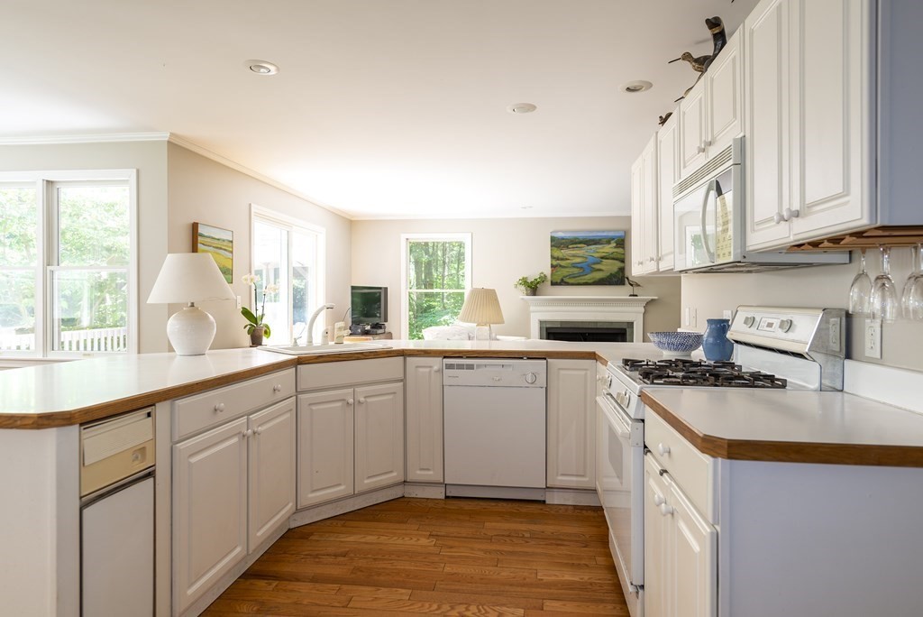 21 Mill Road Ipswich, MA 01938 - Photo 8 of 23 a kitchen with a sink stove and cabinets