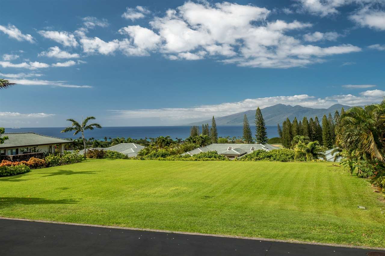 230 Crestview Road, Unit 15 Lahaina, HI 96761 - Photo 4 of 18 a view of a golf course with a lake
