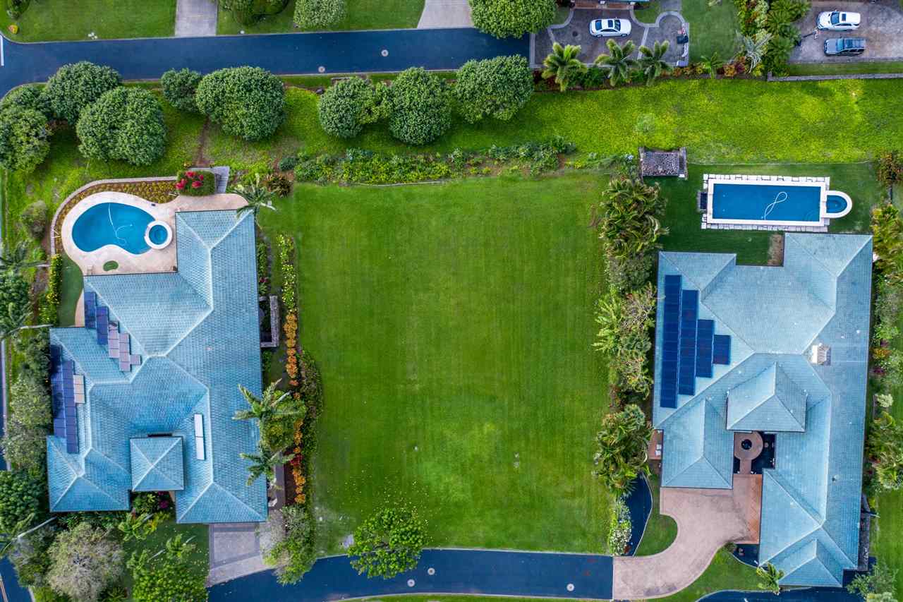 230 Crestview Road, Unit 15 Lahaina, HI 96761 - Photo 5 of 18 an aerial view of a house with a garden and lake view