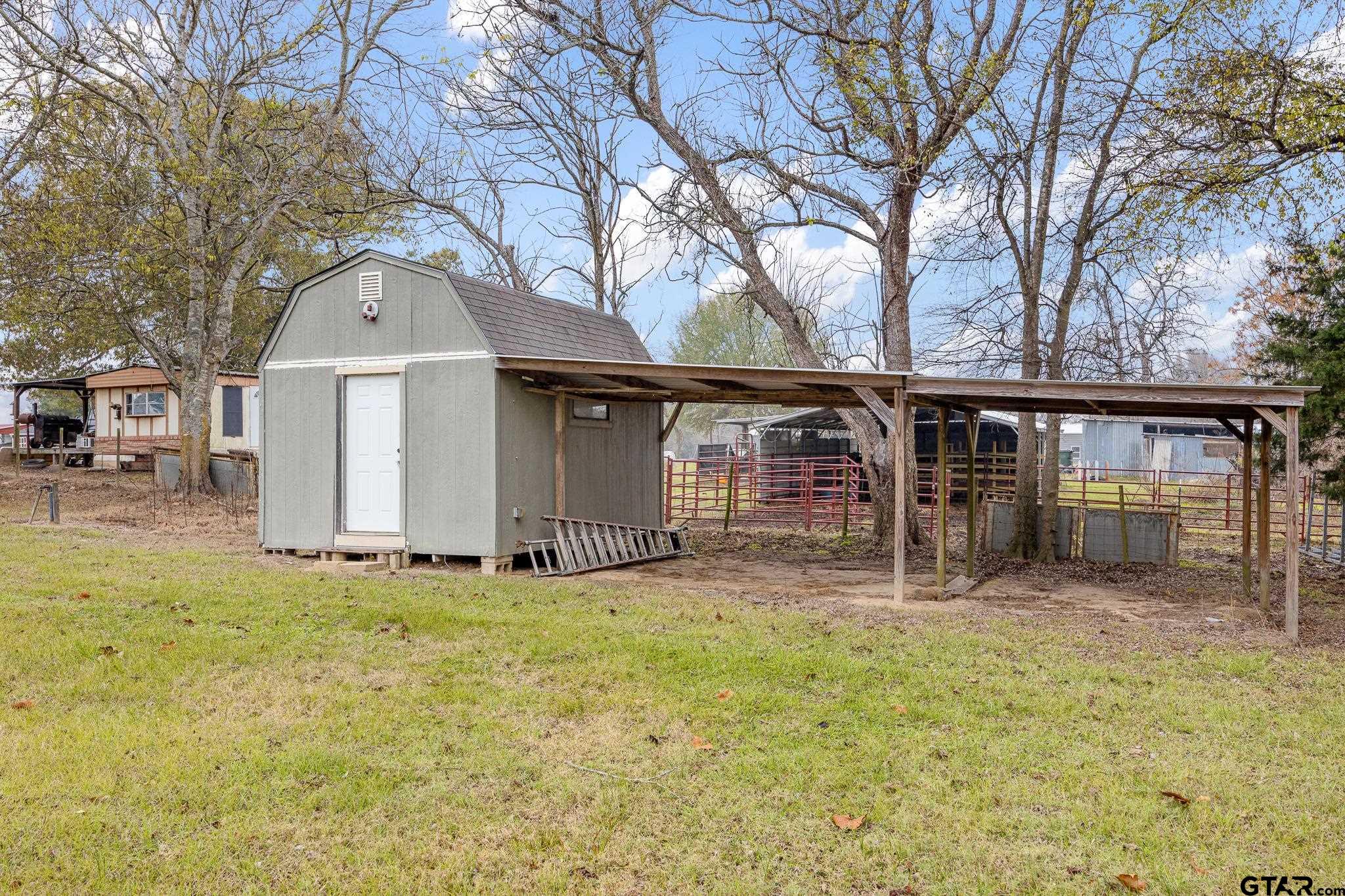11063 County Road 2298 Tyler, TX 75707 - Photo 20 of 21 a front view of a house with garden