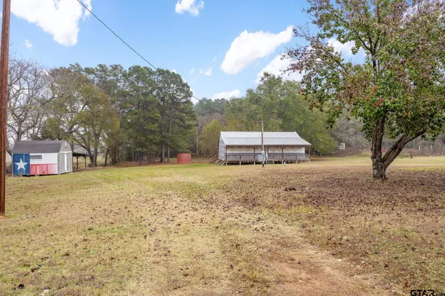 a backyard of a house with lots of green space