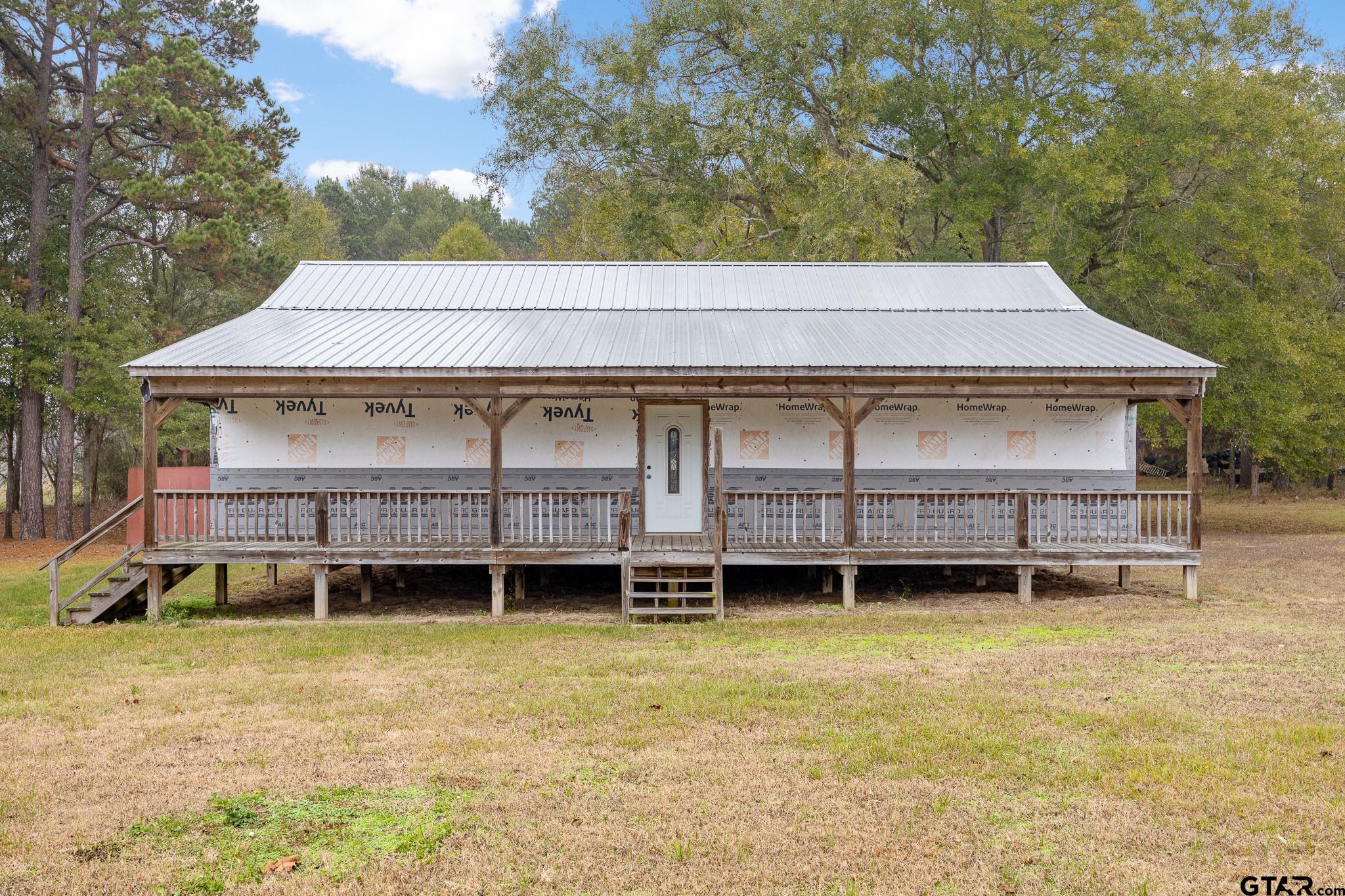 11063 County Road 2298 Tyler, TX 75707 - Photo 6 of 21 a backyard of a house with yard and trampoline