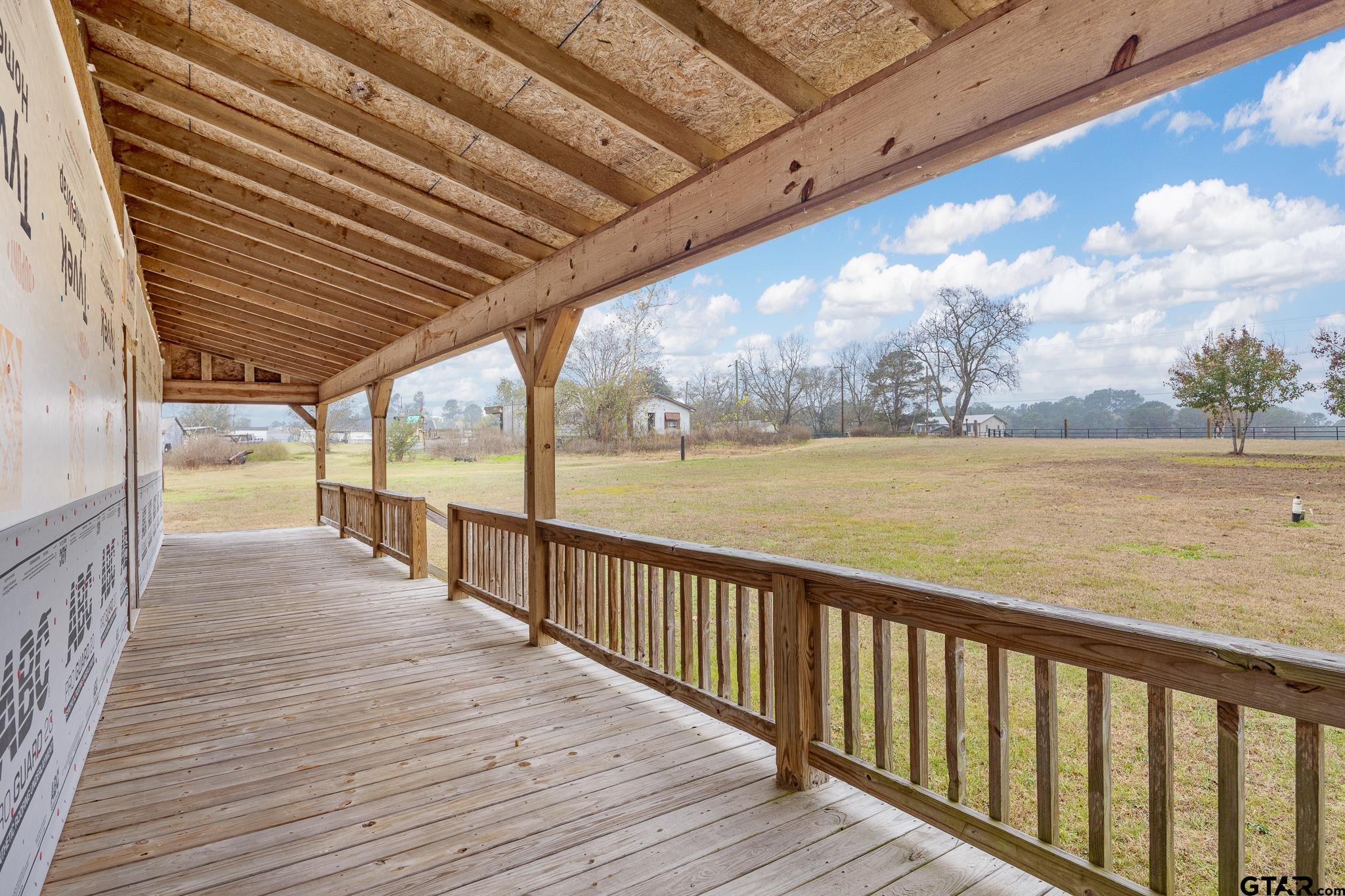 11063 County Road 2298 Tyler, TX 75707 - Photo 7 of 21 a view of a balcony with wooden floor