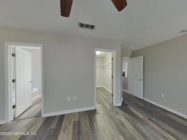 a view of entryway with wooden floor