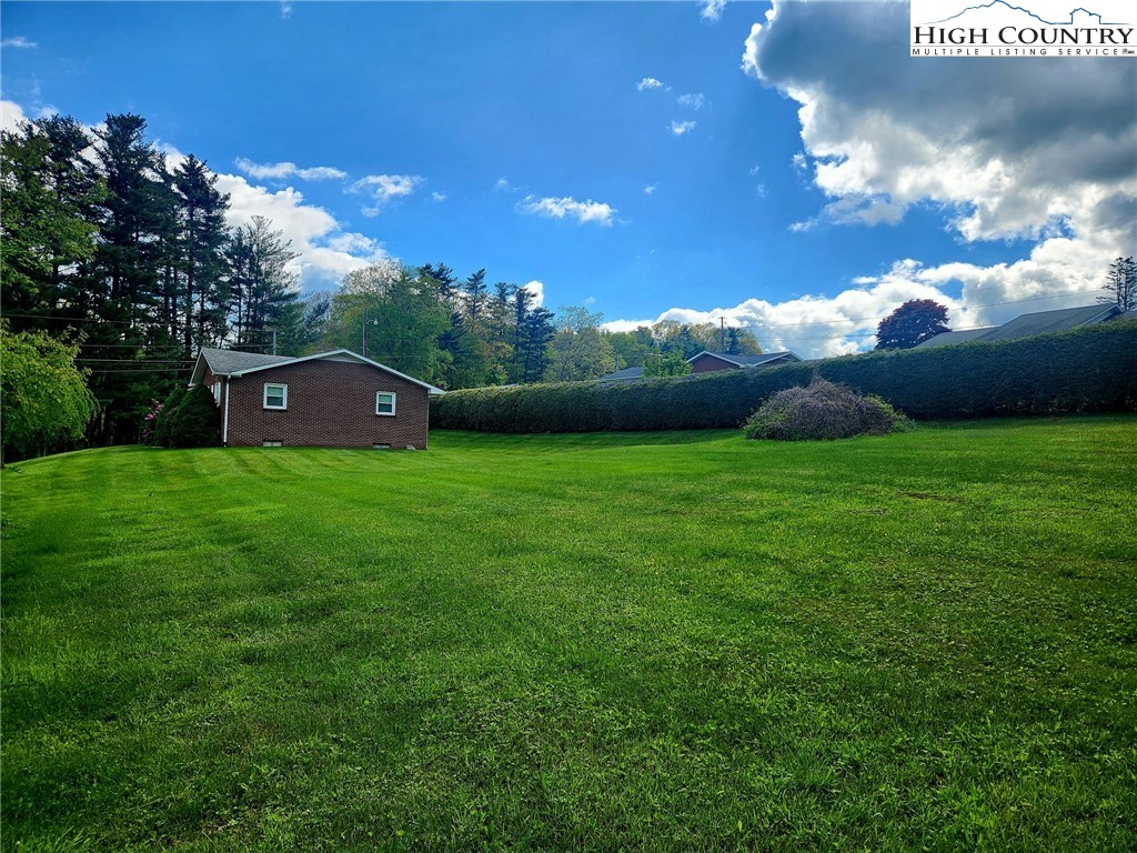 130 Wheeler Street Boone, NC 28607 - Photo 15 of 40 a view of a house with a big yard