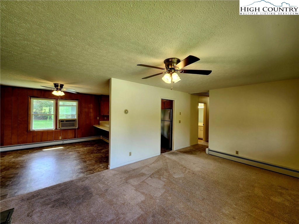130 Wheeler Street Boone, NC 28607 - Photo 24 of 40 an empty room with wooden floor and windows