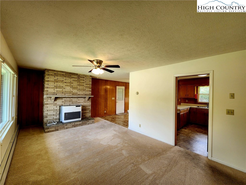 130 Wheeler Street Boone, NC 28607 - Photo 25 of 40 a view of an empty room and a fireplace