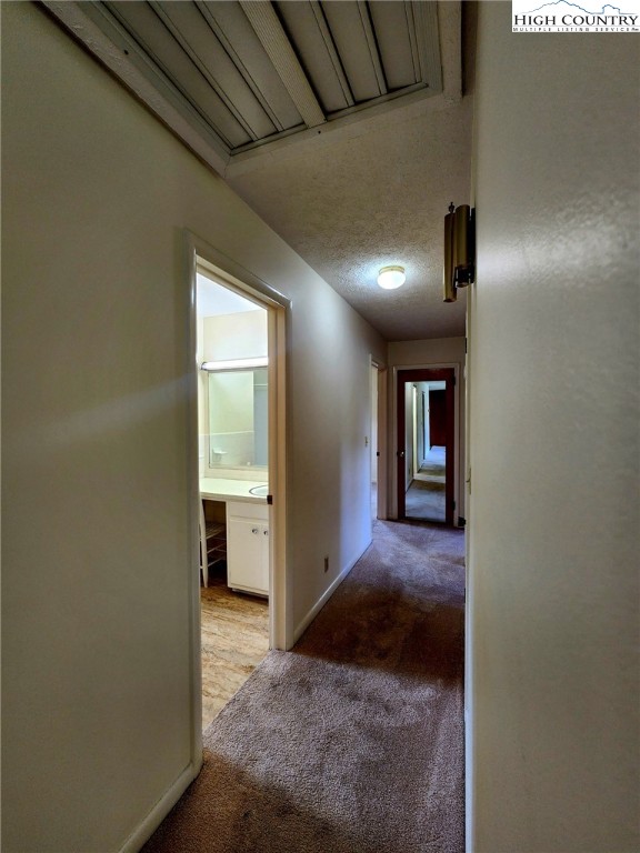 130 Wheeler Street Boone, NC 28607 - Photo 26 of 40 a view of a hallway with wooden floor and a bathroom