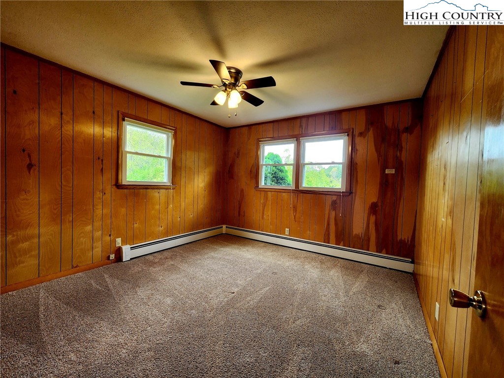 130 Wheeler Street Boone, NC 28607 - Photo 33 of 40 an empty room with windows and fan