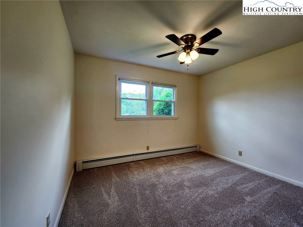 130 Wheeler Street Boone, NC 28607 - Photo 35 of 40 an empty room with window and ceiling fan