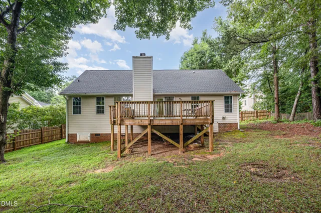 a view of a house with a backyard porch and sitting area