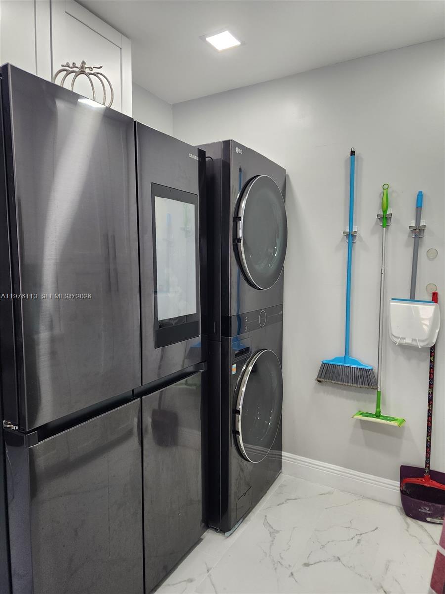 10046 Winding Lake Road, Unit 201 Sunrise, FL 33351 - Photo 5 of 12 a bathroom with a toilet a sink and a shower