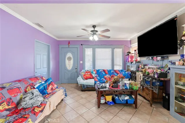 a bed room with furniture and a flat screen tv