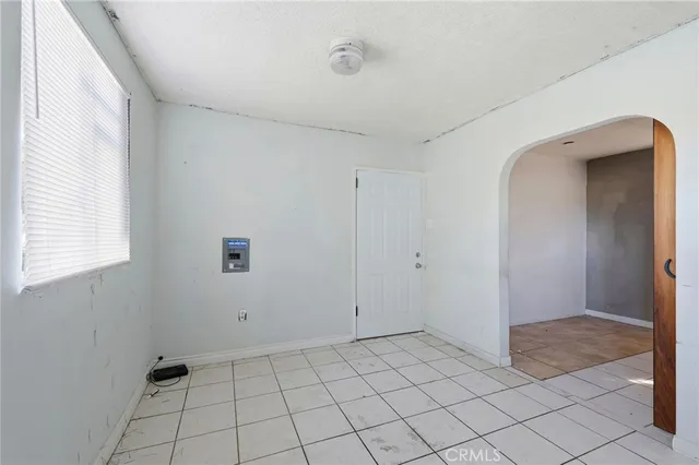 a view of an empty room and window
