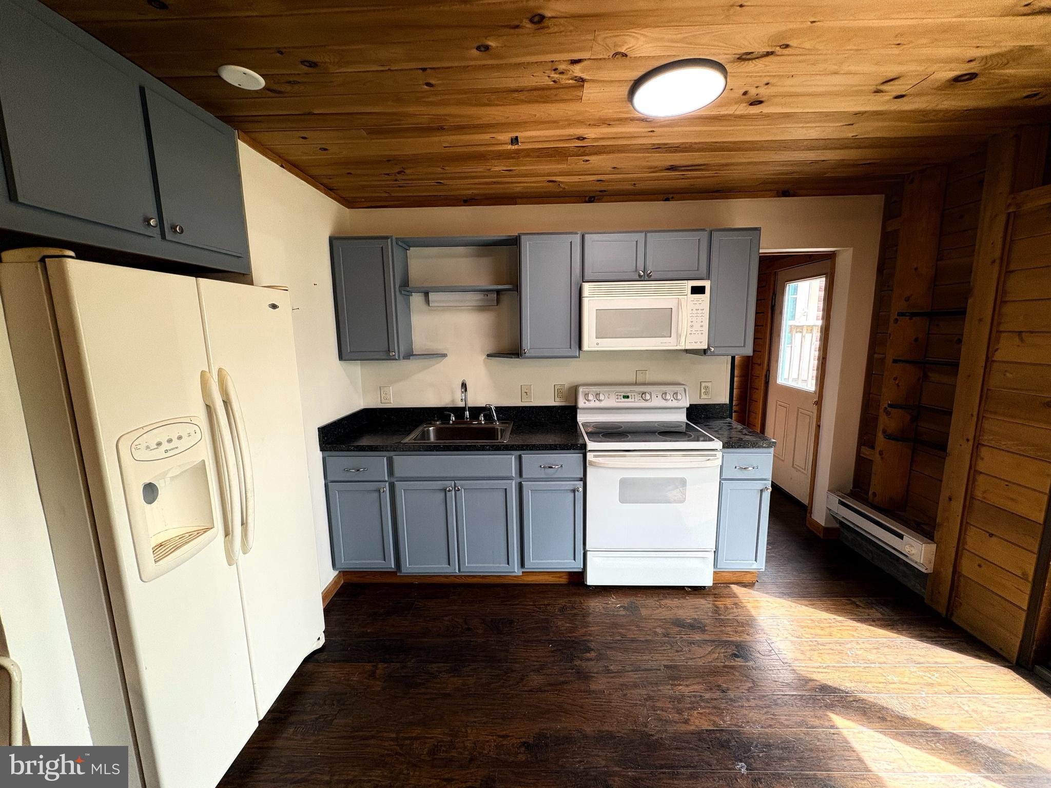 1400 Core Road Romney, WV 26757 - Photo 55 of 73 a kitchen with a refrigerator and a stove