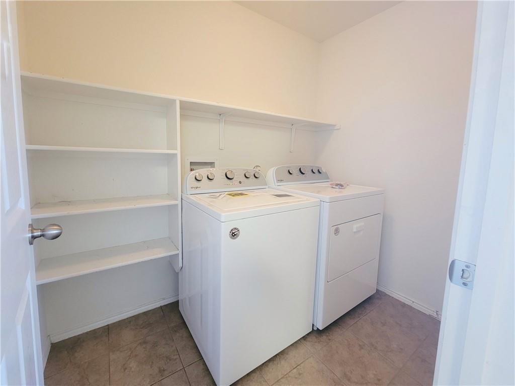 120 Inca Dove Lane Leander, TX 78641 - Photo 8 of 15 a utility room with dryer and washer