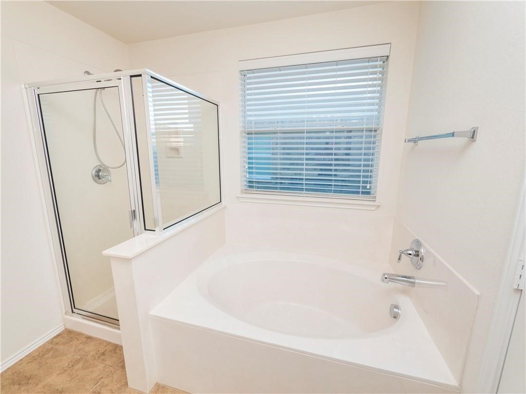 120 Inca Dove Lane Leander, TX 78641 - Photo 10 of 15 a bathroom with a bathtub and a shower