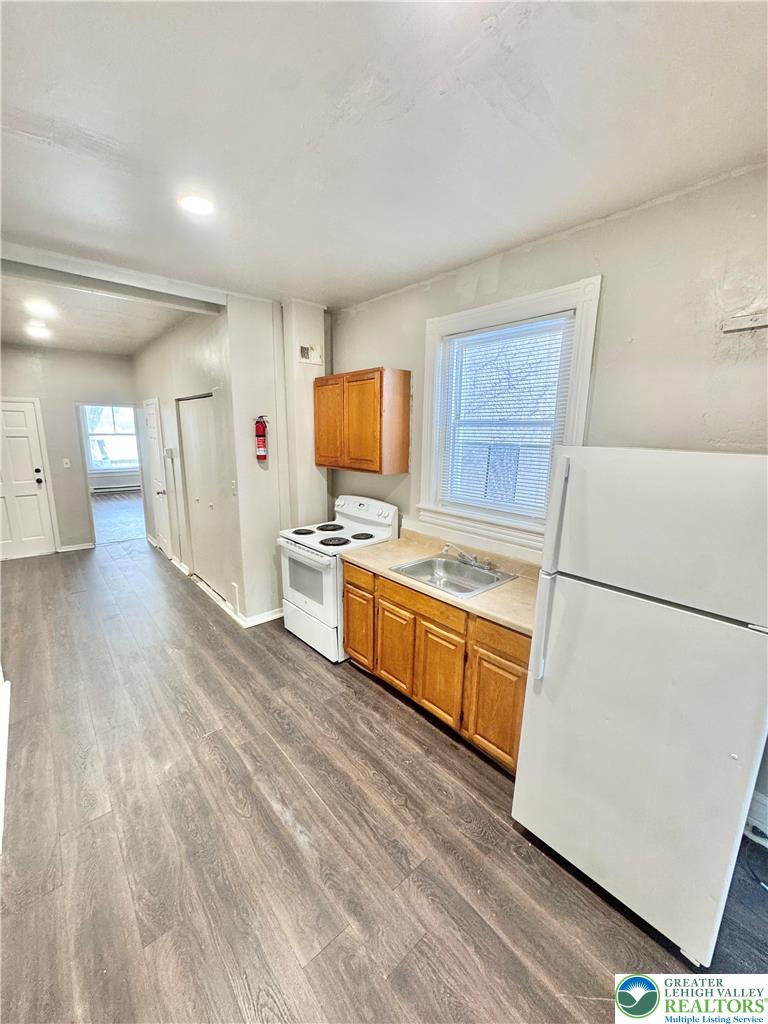 540 Montclair Avenue, Unit 1 Bethlehem, PA 18015 - Photo 6 of 9 a kitchen with granite countertop a refrigerator stove top oven and sink
