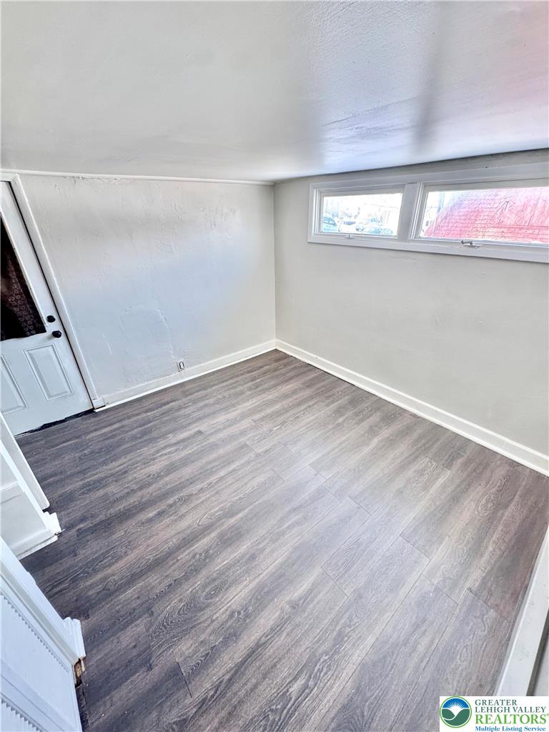 540 Montclair Avenue, Unit 1 Bethlehem, PA 18015 - Photo 8 of 9 a view of an empty room with wooden floor and a window
