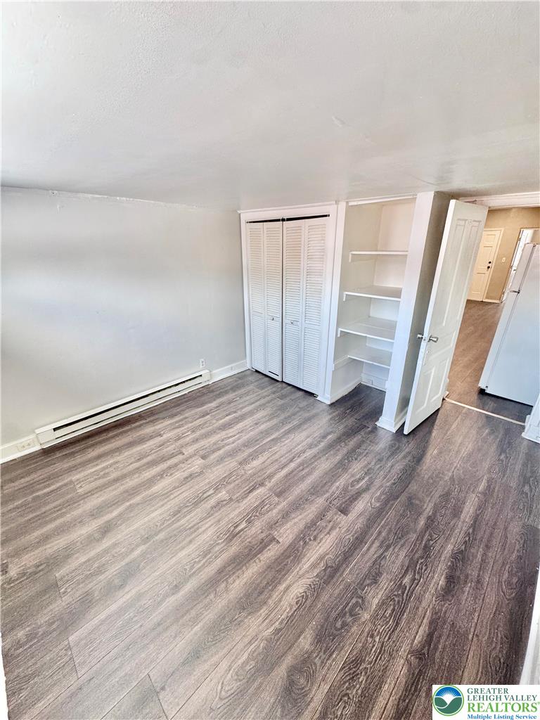540 Montclair Avenue, Unit 1 Bethlehem, PA 18015 - Photo 9 of 9 a view of an empty room with wooden floor and stairs