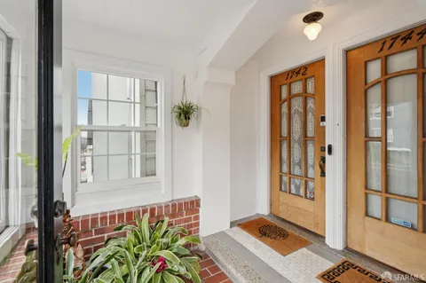 view of living room with furniture and floor to ceiling window