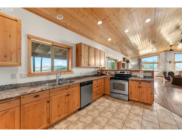 a bedroom with a bed a table and chair