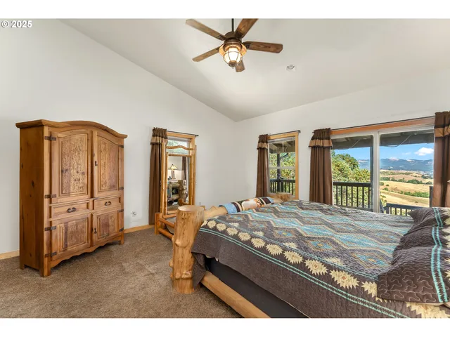 a living room with furniture a fireplace and a chandelier