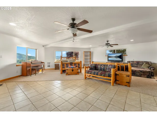 a bedroom with furniture and a flat screen tv