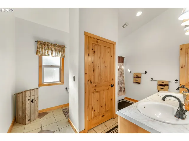 a bathroom with a granite countertop sink mirror and a