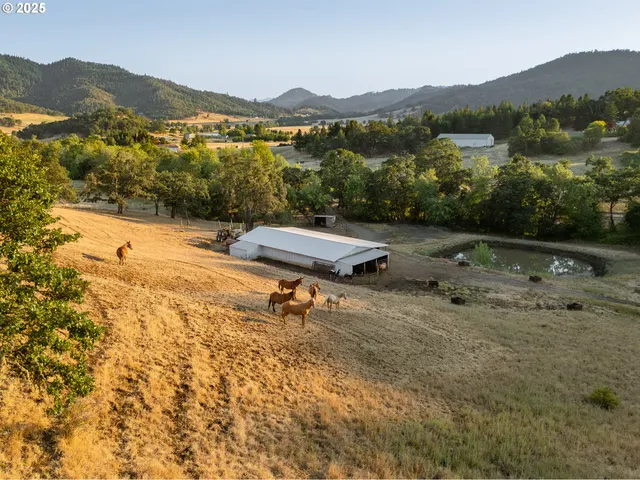 a view of mountain view with wooden fence