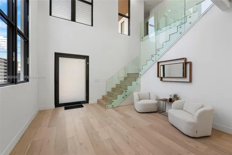 a bedroom with a bed and a dresser with mirror