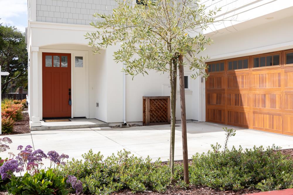 103 Staggi Lane Soquel, CA 95073 - Photo 3 of 35 a front view of a house with a yard and garage