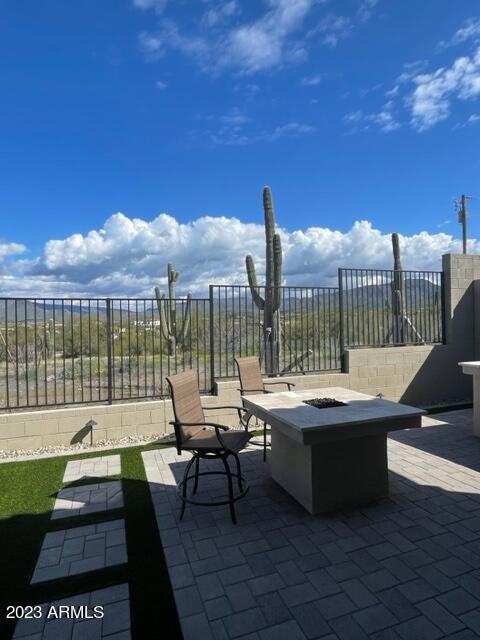 38500 North School House Road, Unit 50 Cave Creek, AZ 85331 - Photo 16 of 17 a terrace with outdoor seating and city view