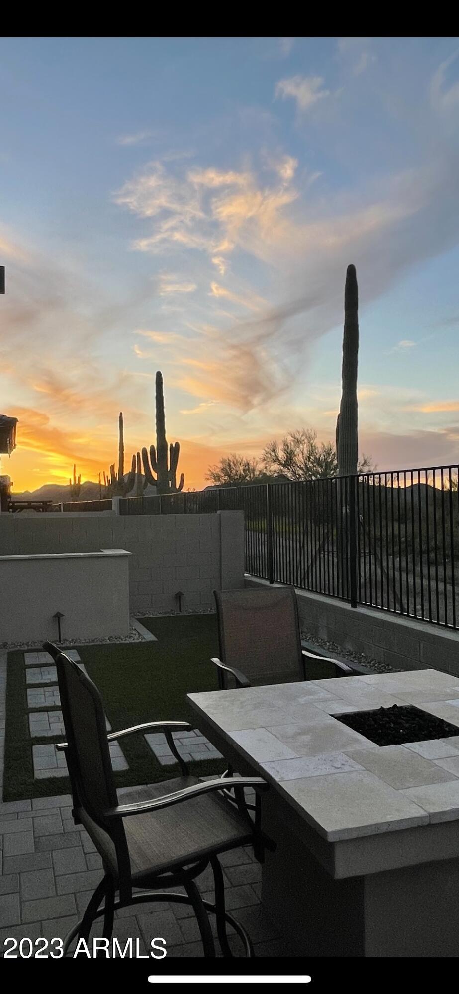 38500 North School House Road, Unit 50 Cave Creek, AZ 85331 - Photo 17 of 17 a terrace with a table and chairs