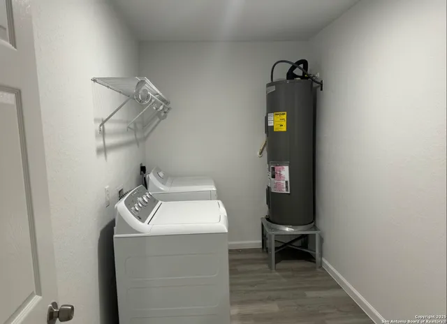 a utility room with dryer and washer