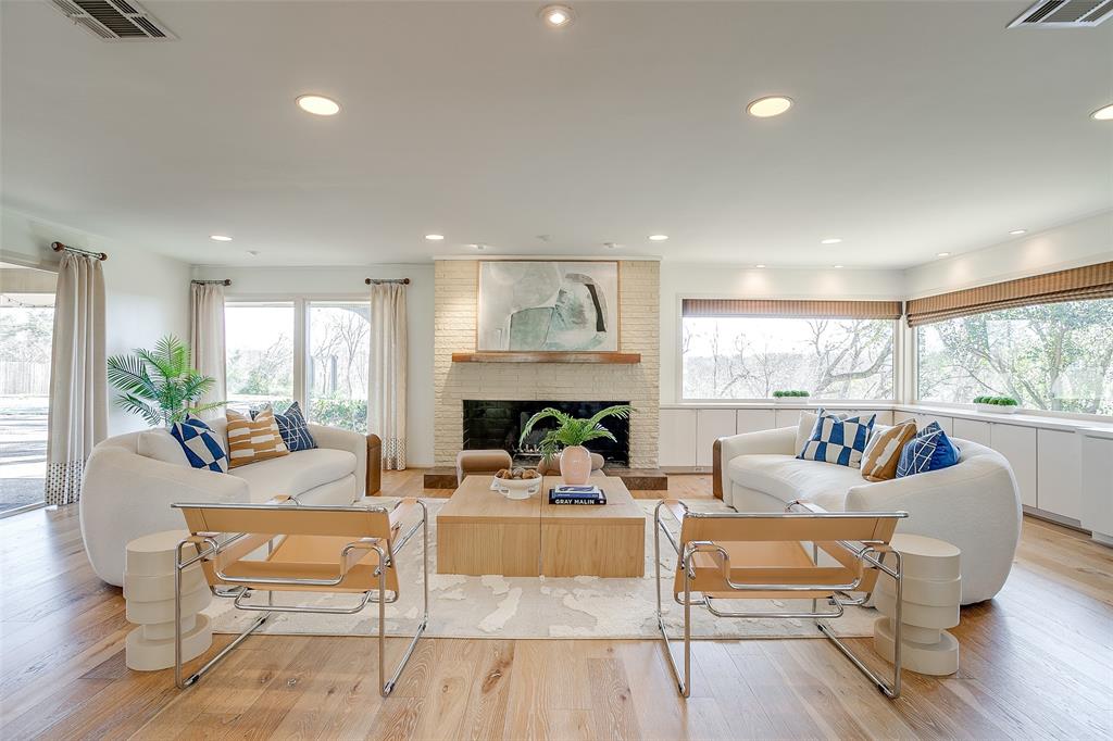 3725 Autumn Drive Fort Worth, TX 76109 - Photo 1 of 1 a living room with furniture a large window and a fireplace