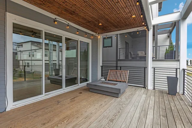 a view of outdoor space wooden floor and windows