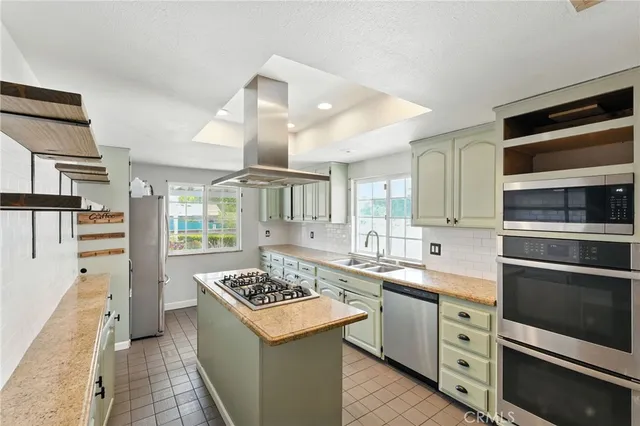 a kitchen with a stove and a sink