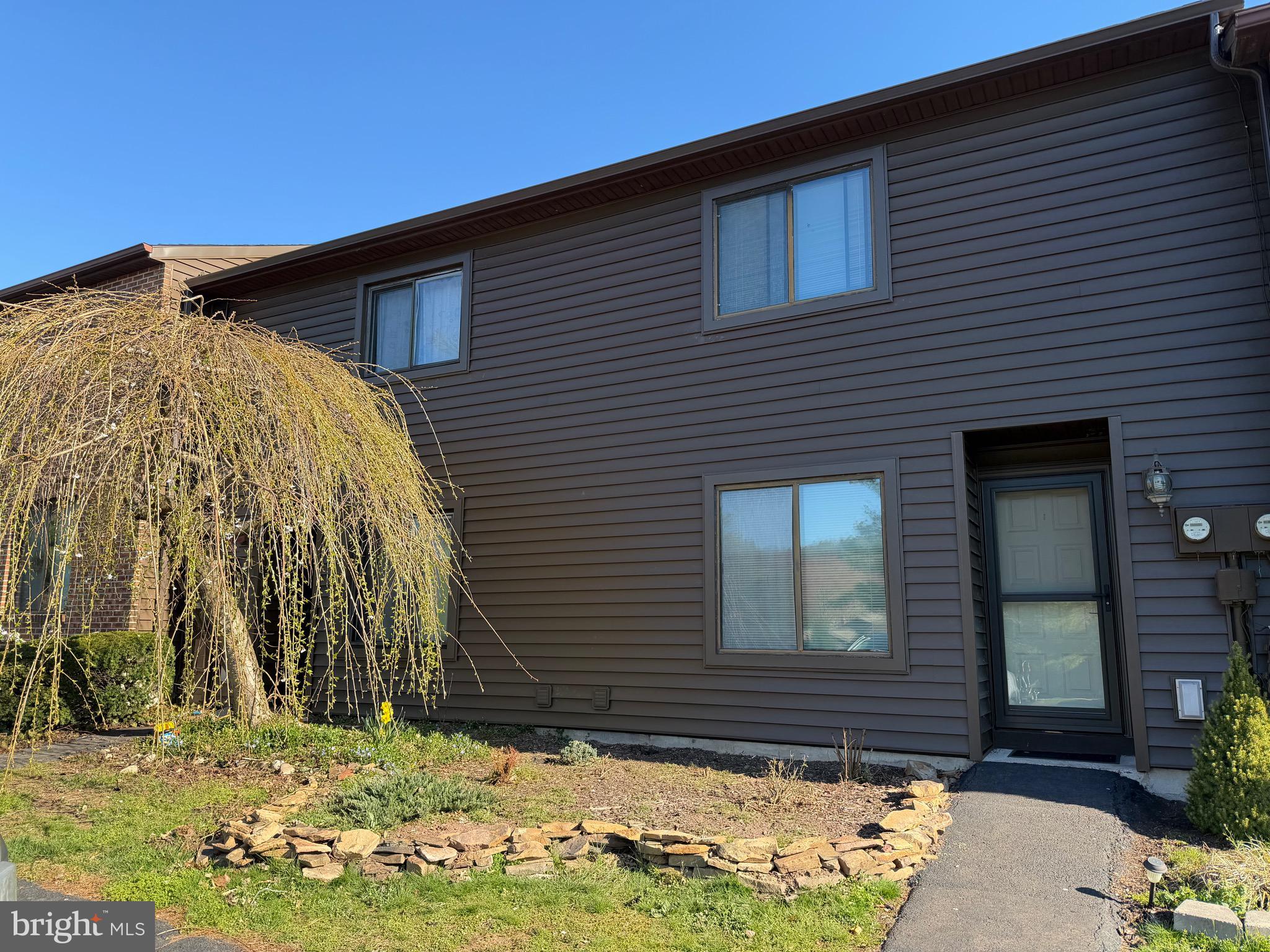 a front view of house with yard