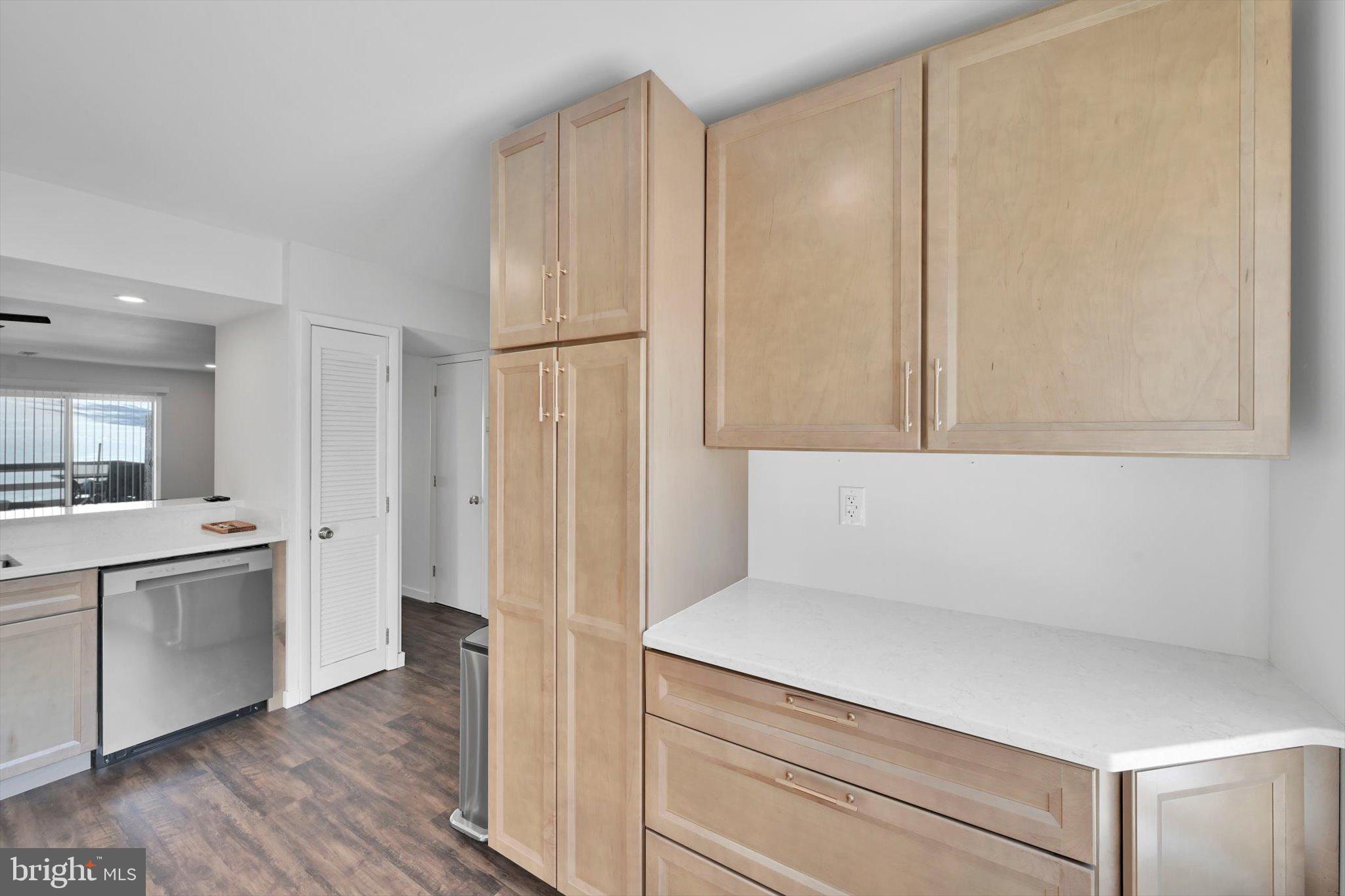 2604 Village Road Orwigsburg, PA 17961 - Photo 15 of 24 a view of a kitchen with white cabinets and wooden floor