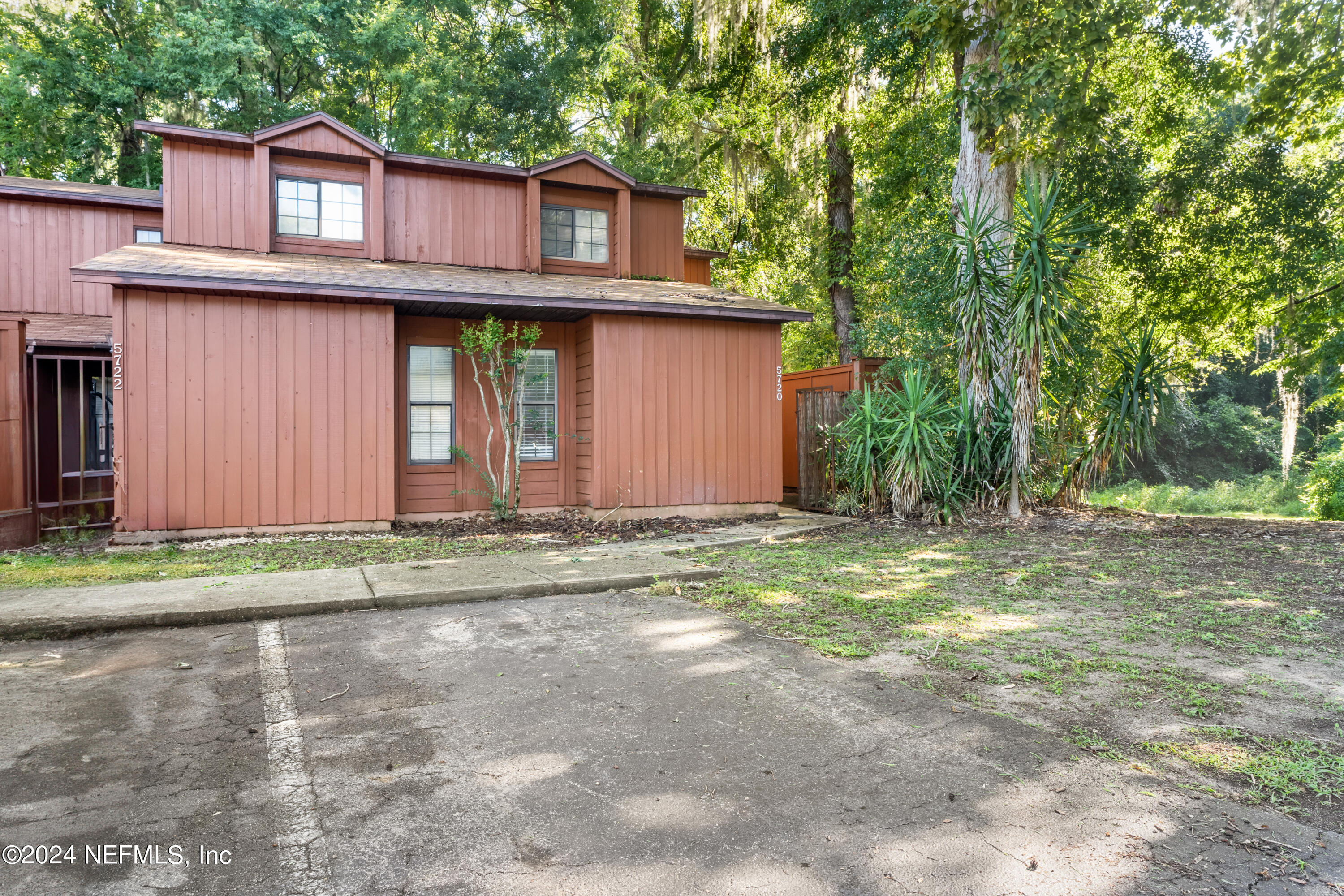 5720 Southwest 8th Place Gainesville, FL 32607 - Photo 17 of 17 a view of a house with a yard