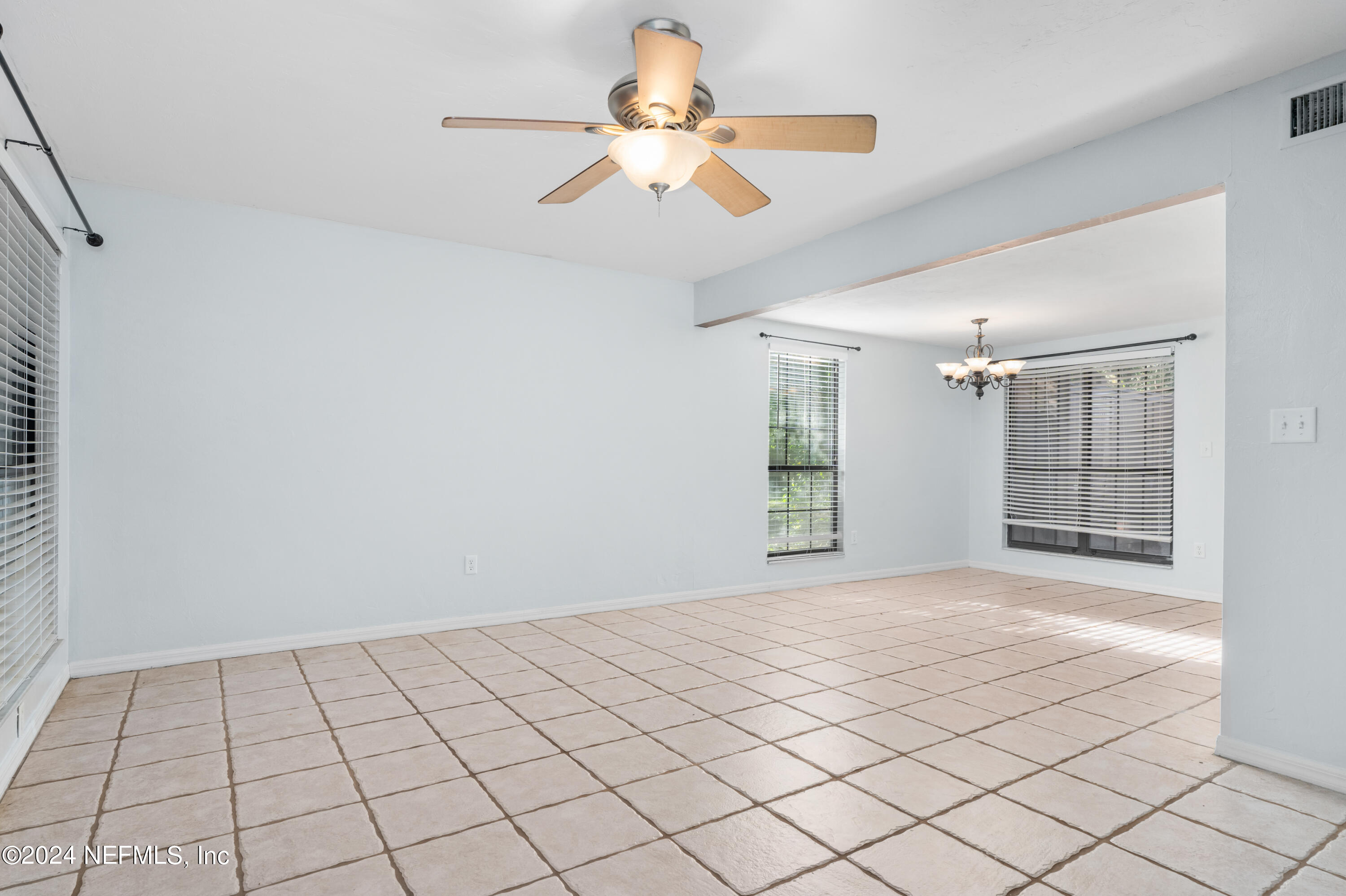 5720 Southwest 8th Place Gainesville, FL 32607 - Photo 2 of 17 a view of an empty room and window