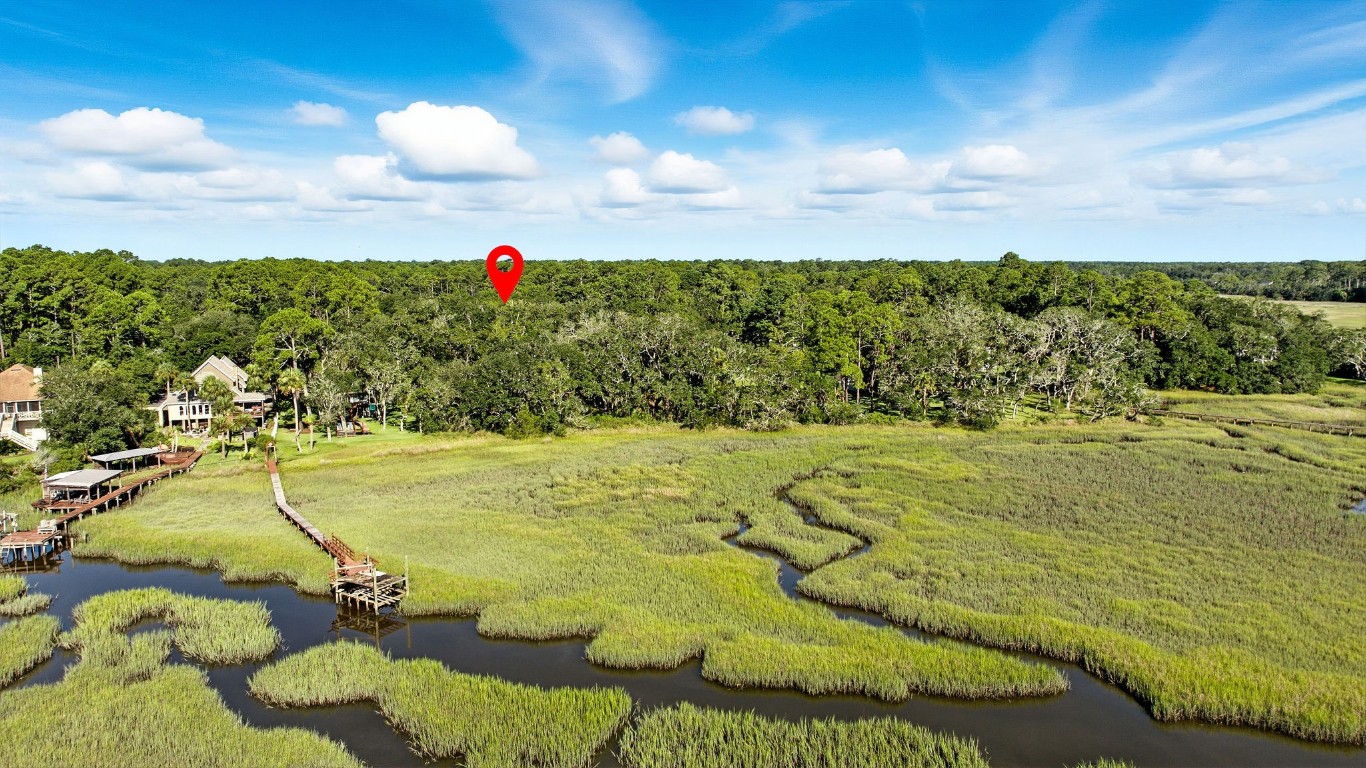 Lot At Lot At End Of Tyson Road Fernandina Beach, FL 32034 - Photo 2 of 10 a view of a swimming pool and an outdoor seating