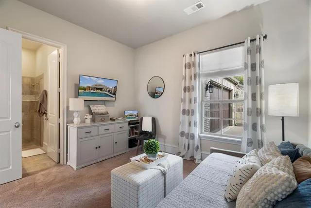 a bedroom with furniture and a window