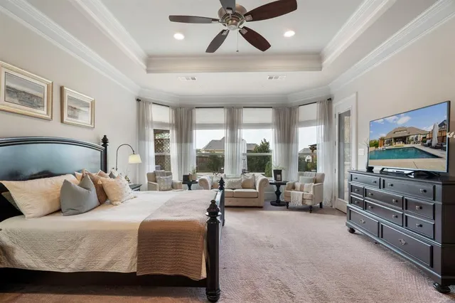 a bedroom with a bed and glass door