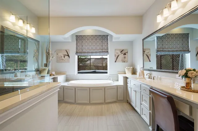 a large kitchen with a sink and cabinets