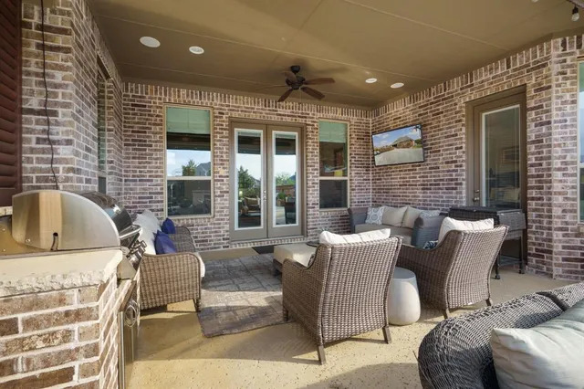 a balcony with furniture and windows