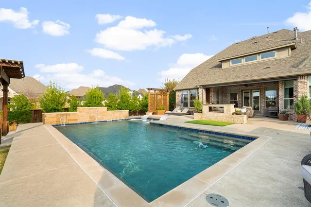 a view of a swimming pool with a patio