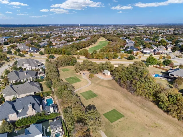 an aerial view of residential building with parking space